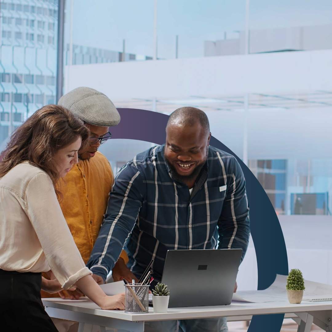 Calm and organized small business team collaborating together in modern workspace